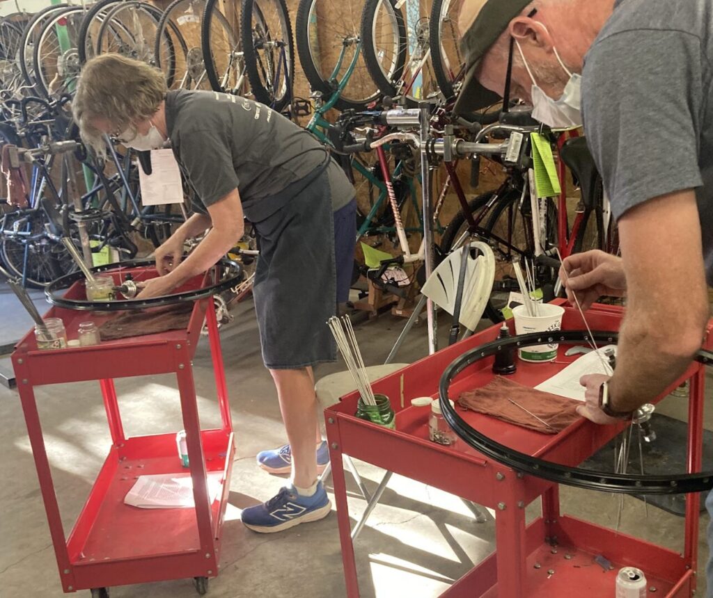 people working on wheels